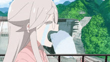 a girl with white hair is crying in front of a waterfall