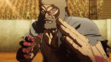 a man with a beard is holding a red object in his hands