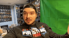 a man wearing a hoodie that says pro wrestling on it