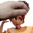 a cartoon girl is being touched by a hand on her forehead .