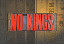a sign that says " no kings " in red letters