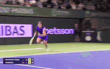 a tennis player is running on a court in front of a sign that says " betsson "