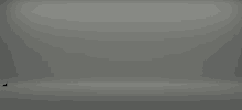 a gray background with a few spots of light on it