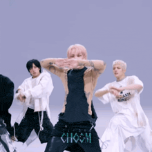 a group of young men are dancing in front of a choom sign