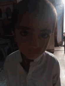 a close up of a woman 's face with a blurred background