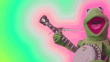 kermit the frog is playing a banjo and singing .