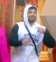 a man wearing a hoodie that says social justice club