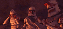 three clone troopers are standing next to each other and saluting