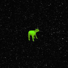 a green alien is flying through the space