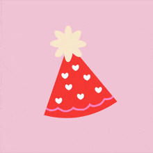 a red party hat with white hearts on it and a yellow flower on top