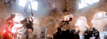 a group of people are standing in a room with a lot of smoke coming out of the ceiling .