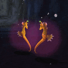 two seahorses with red hearts on their faces
