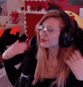 a woman wearing headphones that say jbl on the side