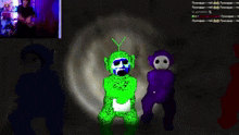 a green and purple teddy bear are standing next to each other