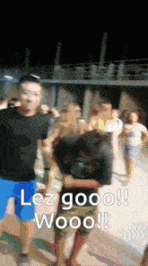 a man in a black shirt and blue shorts says lez gooo