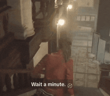 a person in a red jacket is walking down a hallway with the words wait a minute written below them