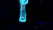 a woman in a futuristic outfit is holding a pink object in her hands