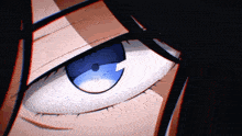 a close up of a woman 's eye with a blue pupil
