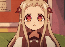 a girl with long blonde hair and red eyes is sitting on a green couch