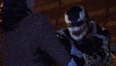 a close up of venom looking at a woman