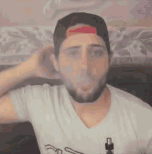 Blowing Smoke Out Turning Hat GIF - Blowing Smoke Out Turning Hat Hi Haters GIFs