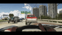 a ford truck is driving down a highway in front of a sign that says ' jacksonville '