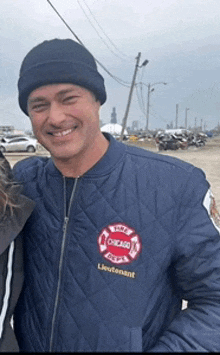 a man wearing a chicago lieutenant jacket poses for a photo