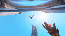 a person is flying through the air with a glove on their hand