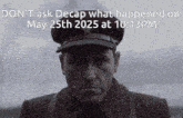 a man wearing a hat with the words " do n't ask decap " on it