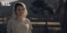 a woman wearing a shirt that says be fearless on it