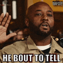 a man says he bout to tell in a trap city ad
