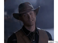 a man wearing a cowboy hat and a vest is making a funny face