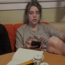 a girl wearing a shirt that says run like hell