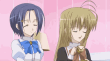 two anime girls are standing next to each other with one holding a cup of tea