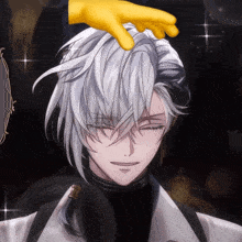 a man with a yellow glove on his head