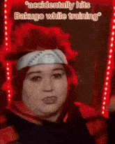 a woman with red hair and a bandana on her head is wearing a costume .