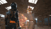 a man in a black and orange costume with the letter y on the back