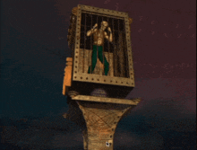 a statue of a man in a cage with the number 6 on the front