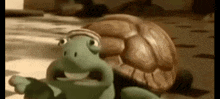 a cartoon turtle is looking at the camera with a surprised look on its face .