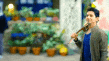a blurry picture of a man carrying a guitar