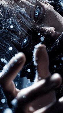 a close up of a person 's face with snow on it