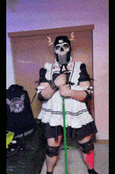 a man in a maid costume with a skull mask on his face
