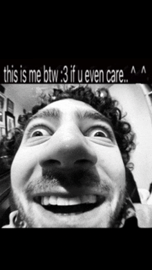 a black and white photo of a smiling man with the caption " this is me btw 3 if u even care "