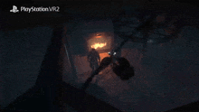 a playstation vr2 screen shows a fireplace