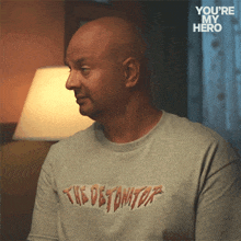 a man wearing a shirt that says the detonator on it