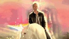 Neil Patrick Harris On Unicorn GIF - Neil Patrick Harris Unicorn Rainbow GIFs