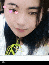 a close up of a woman with hearts on her eyes