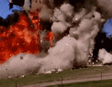 a large explosion with a lot of smoke coming out of it .