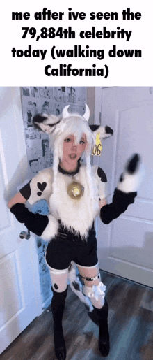 a woman in a cow costume is standing in front of a door in california