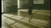a person is running in a dark room with a imgflip.com logo in the corner